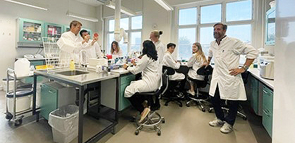 Photo of group members in lab